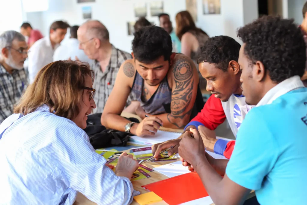 Students practicing Dutch at a language café in Utrecht – relaxed group setting for conversation and cultural exchange.